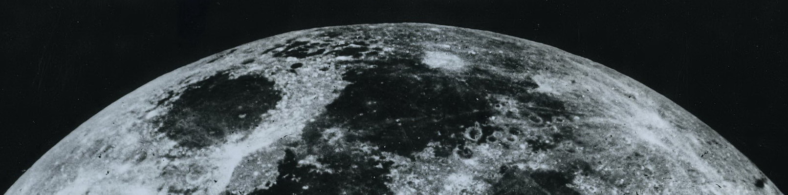 Cropped reproduction of Louis Daguerre’s earliest surviving photograph of the moon, taken on January 2, 1839. The gray lunar surface shows dark, rounded maria and lighter highland regions with scattered craters. The original daguerreotype was later destroyed in a fire.